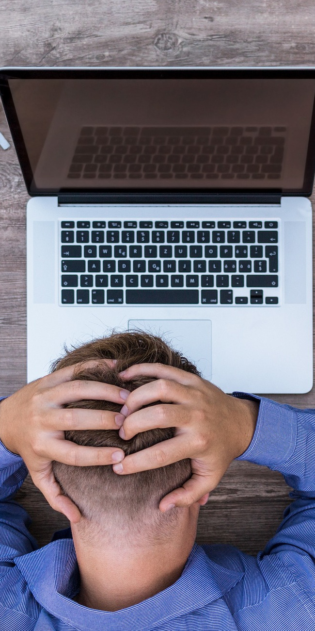 Frustrated man on computer